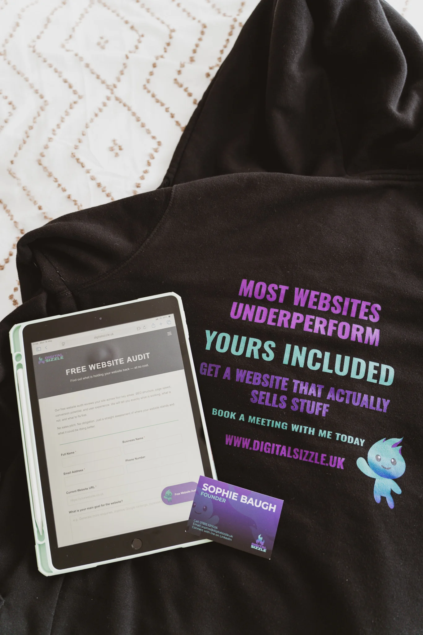 Digital Sizzle branded tablet, t-shirt, business cards and phone displaying brand identity work